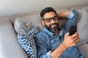 Man relaxing on his phone