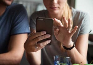 Couple using mobile phone